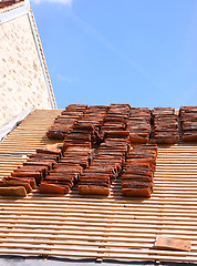 Image showing renovation of a tiled roof of an old house