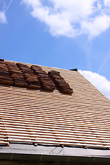 Image showing renovation of a tiled roof of an old house