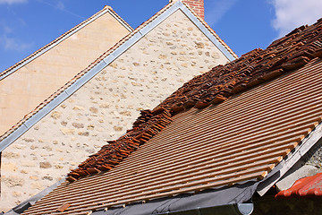 Image showing renovation of a tiled roof of an old house