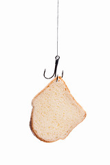 Image showing piece of bread hanging on hook