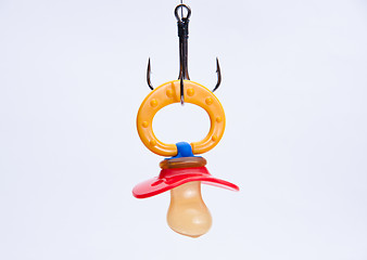 Image showing infant pacifier hangs on a hook