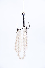 Image showing jewelry made of pearls hanging on fishing hook