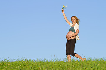 Image showing pregnant woman on meadow