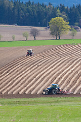 Image showing tractor plowing filed