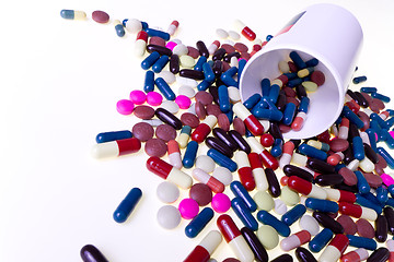 Image showing pills spilling out of container 