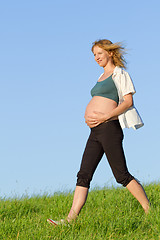 Image showing pregnant woman on meadow