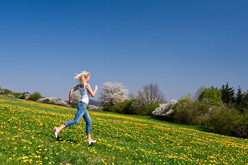 Image showing happy young woman on meadow