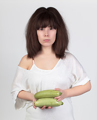 Image showing The young beautiful woman with the fresh vegetables