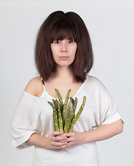 Image showing The young beautiful woman with the fresh vegetables