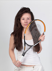 Image showing Young woman with tennis racket isolated on white