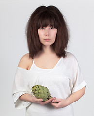 Image showing The young beautiful woman with the fresh vegetables