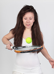 Image showing Young woman with tennis racket