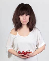 Image showing The young beautiful woman with the fresh vegetables