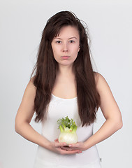 Image showing The young beautiful woman with the fresh vegetables