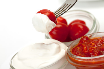 Image showing Sour Cream, Catchup and tomato on fork