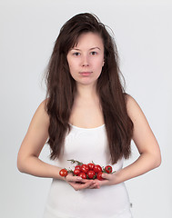 Image showing The young beautiful woman with the fresh vegetables