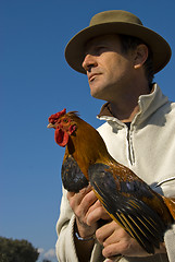 Image showing man and chicken