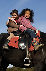 Image showing two riding little girls