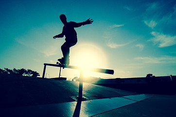 Image showing Skateboarder silhouette on a grind