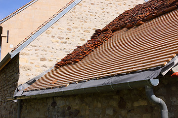 Image showing renovation of a tiled roof of an old house