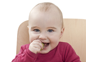 Image showing child in red shirt eating