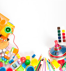 Image showing children's toys scattered on a white sheet