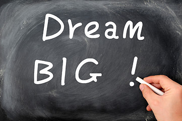Image showing Dream big written with chalk on a blackboard background