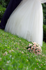 Image showing bridal bouquet lies on the grass