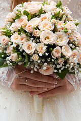 Image showing Bride holding wedding bouquet