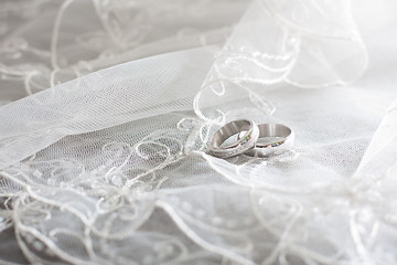 Image showing ring of white gold are on the bride's veil