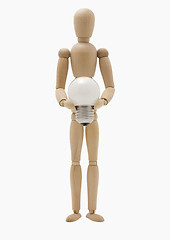 Image showing Wooden mannequin holding lamp