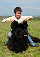 Image showing little girl and big dog