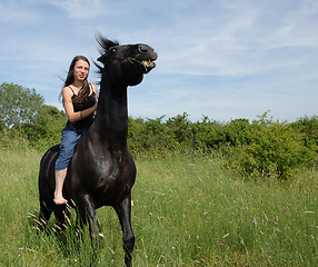 Image showing young woman and horse