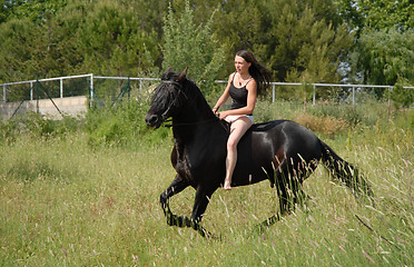 Image showing young woman and horse