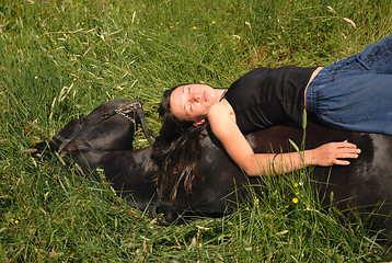 Image showing horse laid down and riding girl