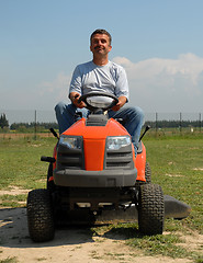 Image showing man and lauwn mower