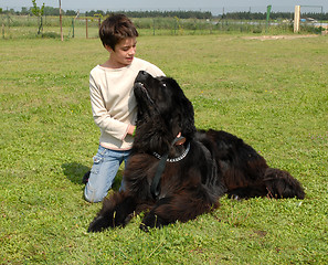 Image showing little girl and big dog