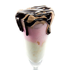 Image showing icecream in a wine glass with melted chocolate dripping