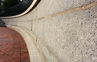 Image showing Curving Cement Wall with bricks and Iron fence