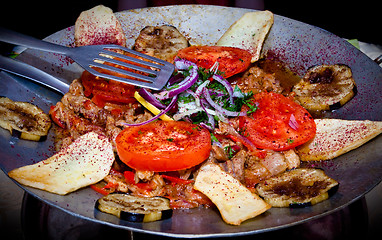 Image showing metal dish with fried meat and vegetables