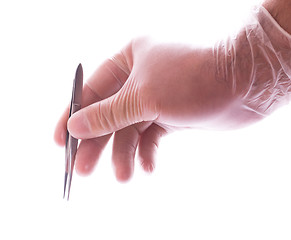 Image showing hand in rubber glove holding tweezers