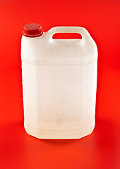 Image showing white dusty canister on red 