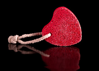 Image showing red heart-shaped stone with rope