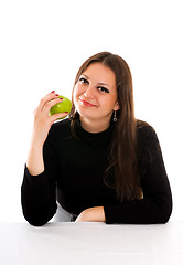 Image showing smiling young woman with apple