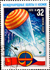 Image showing postage stamp shows parachute with spacecraft capsule