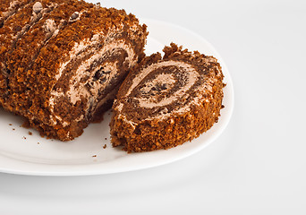 Image showing sliced chocolate roll on white dish