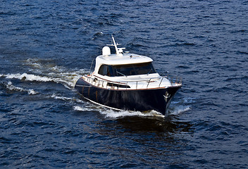 Image showing fast white motor boat on blue water