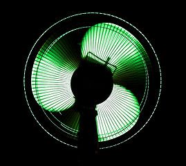 Image showing big office fan in green light