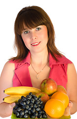 Image showing beautiful smiling girl with dish of fruits