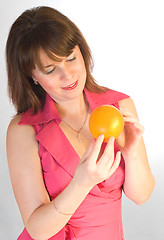 Image showing beautiful girl with orange in hands